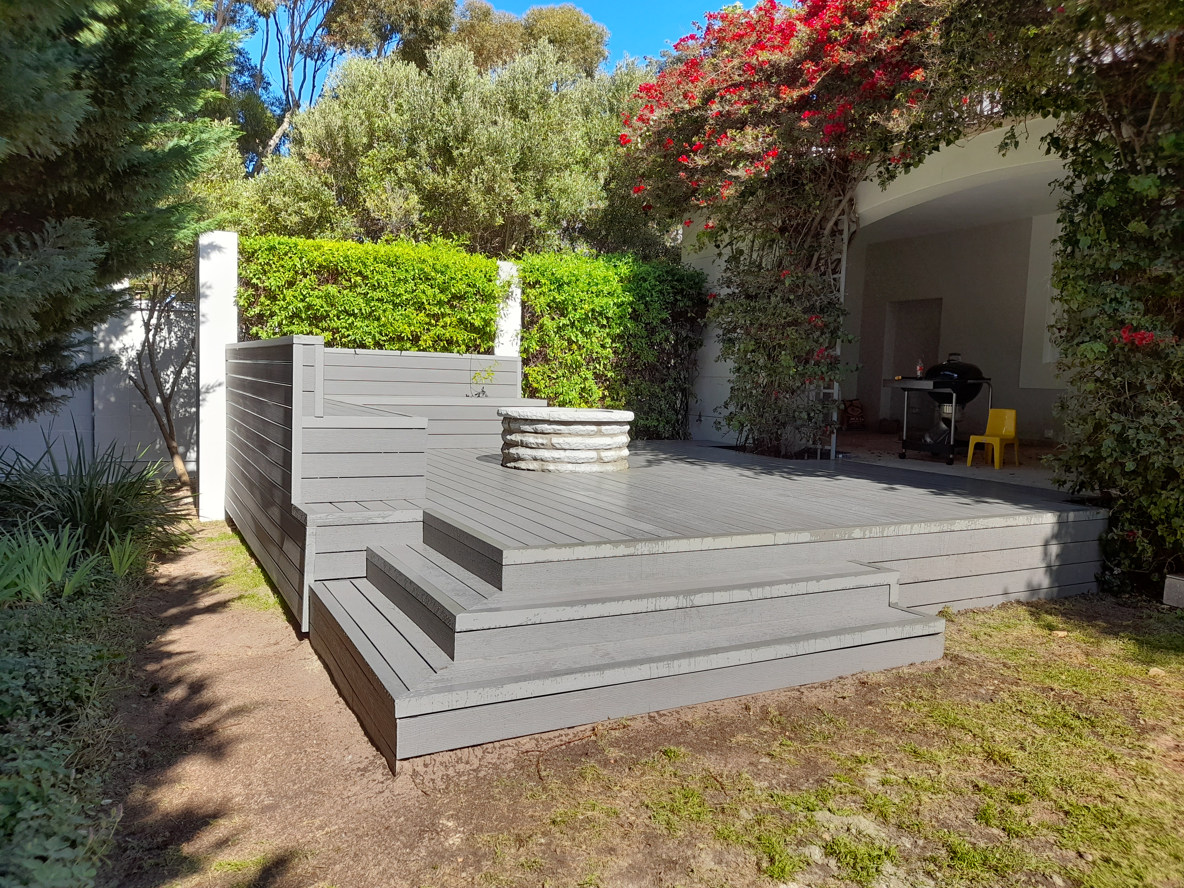 Garden Deck with Built-in Seating by Cutting Edge Carpenters