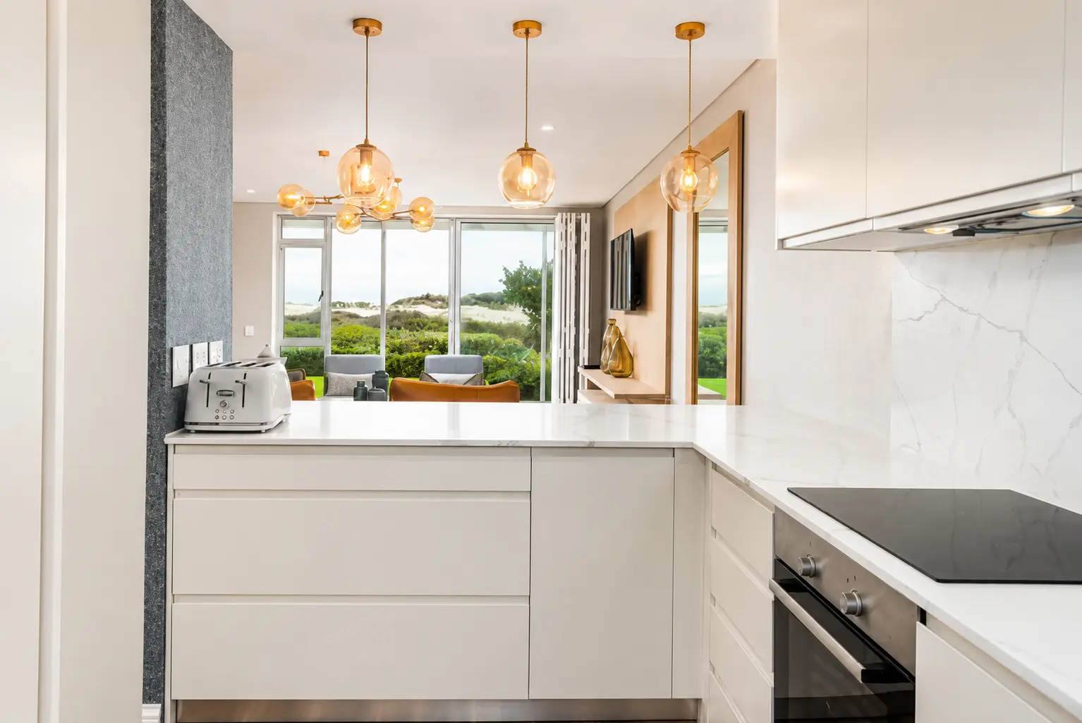 Bright custom kitchen with white cabinetry and central island