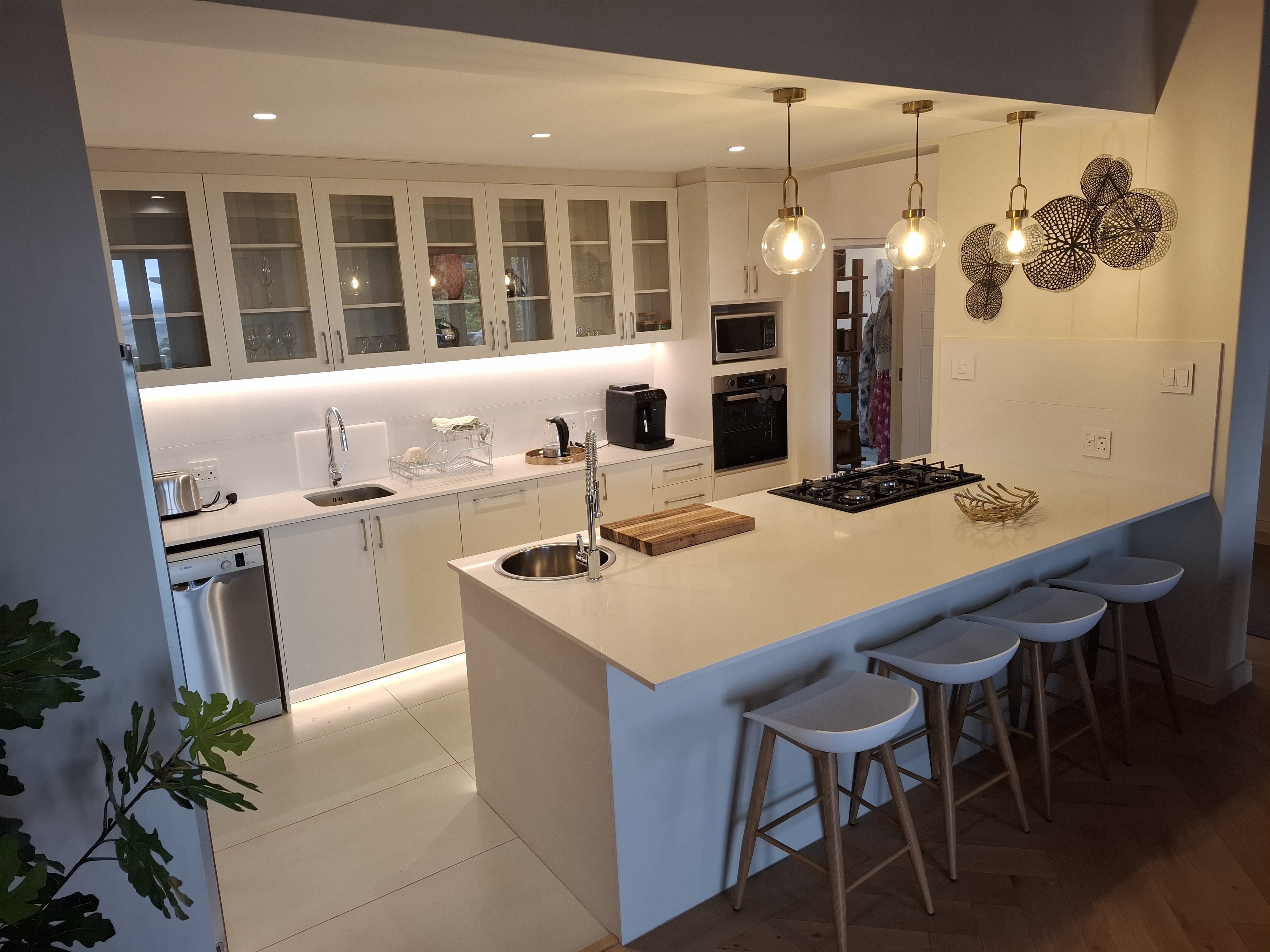 Classic White Kitchen with Island by Cutting Edge Carpenters