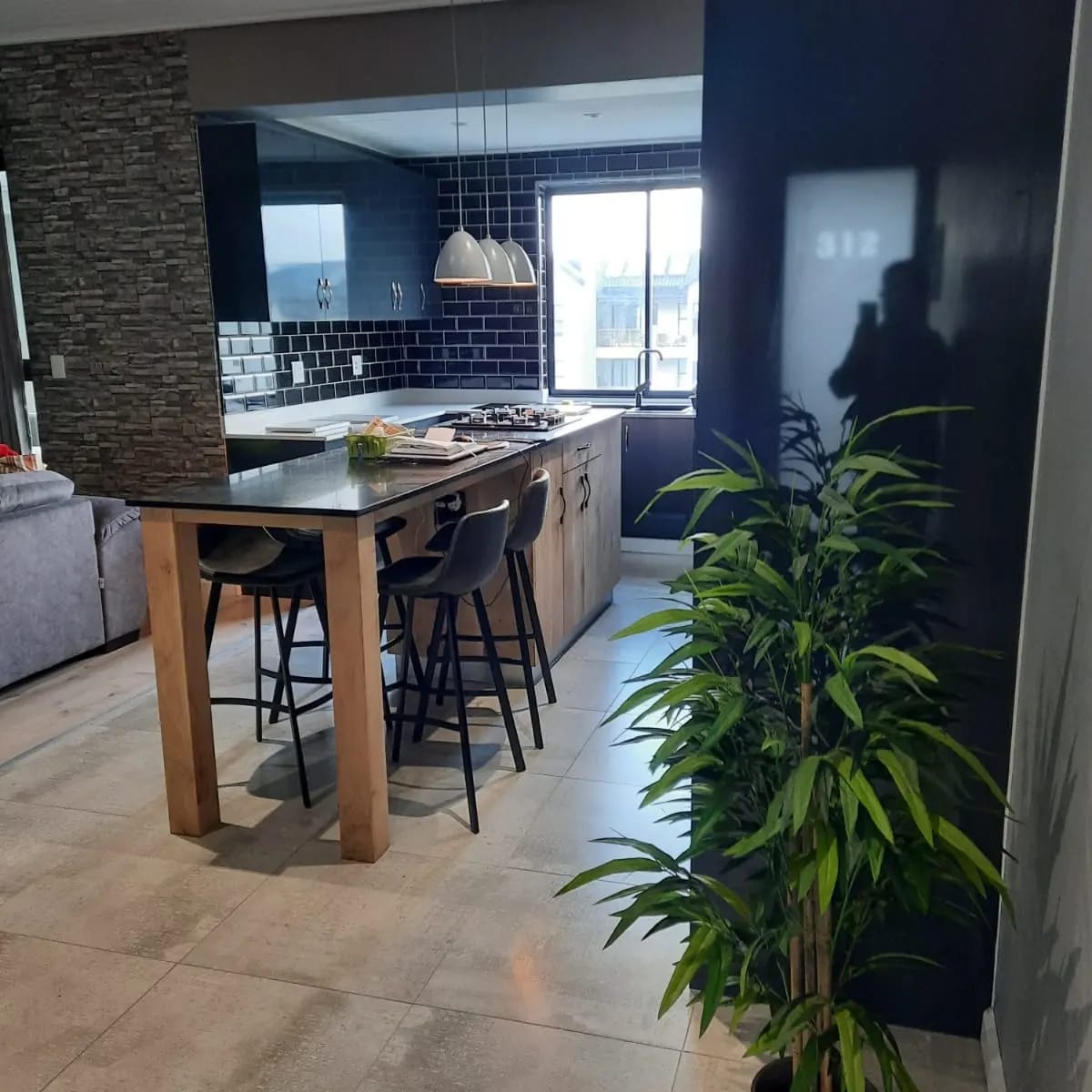 Dark Kitchen with Timber Island by Cutting Edge Carpenters